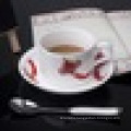 Chinese white ceramic coffee cup and saucer with decal